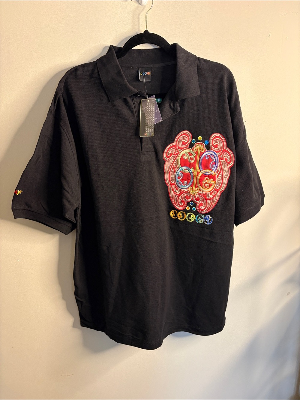 COOGI Black Polo with Colorful Embroidered Chest Motif